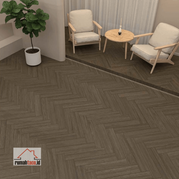 Motif lantai SPC TACO Herringbone TV 5532 SHR Saddle Oak terpasang di ruangan dengan pola zigzag cokelat medium klasik